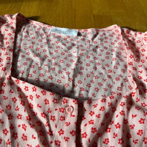 Elodie short sleeved top, size Small. There is a square neck and front buttons.